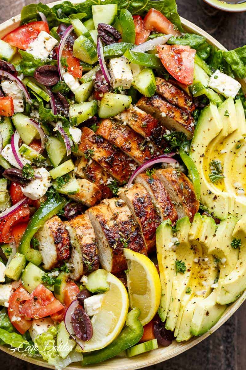 Loaded Greek Chicken Avocado Salad is another meal in a salad! Full of Greek flavours and a 5-ingredient dressing that doubles as a marinade! | https://cafedelites.com