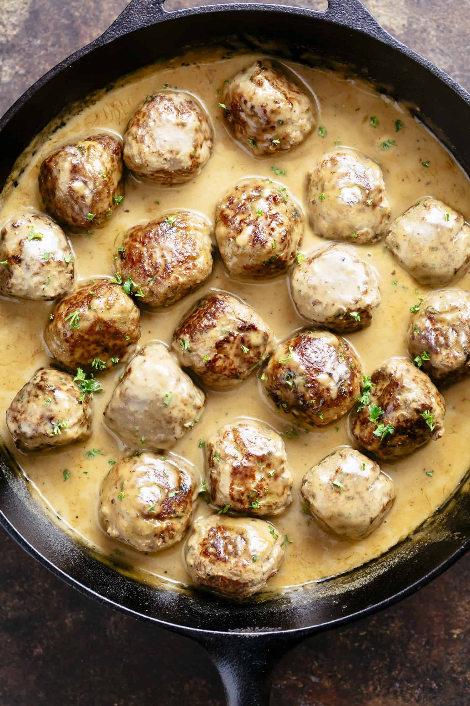 The best Swedish meatballs recipe you'll ever try, swimming in a delicious gravy sauce! | https://cafedelites.com