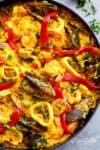 This Classic Spanish Paella rivals any restaurant paella! Sometimes nothing compares to good home cooking, and recipe by a beloved mother | https://cafedelites.com