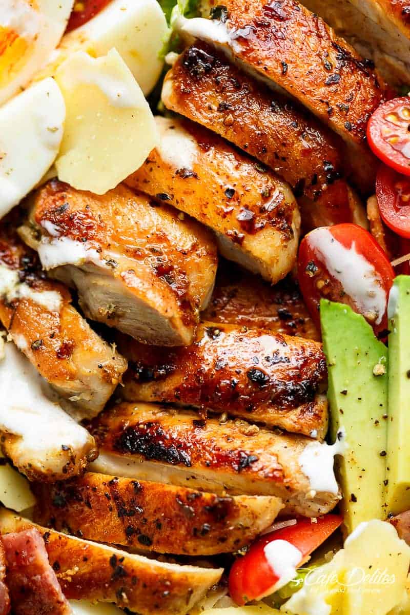 Grilled Chicken Cobb Caesar Salad is a meal in a salad Grilled Chicken Cobb Caesar Salad