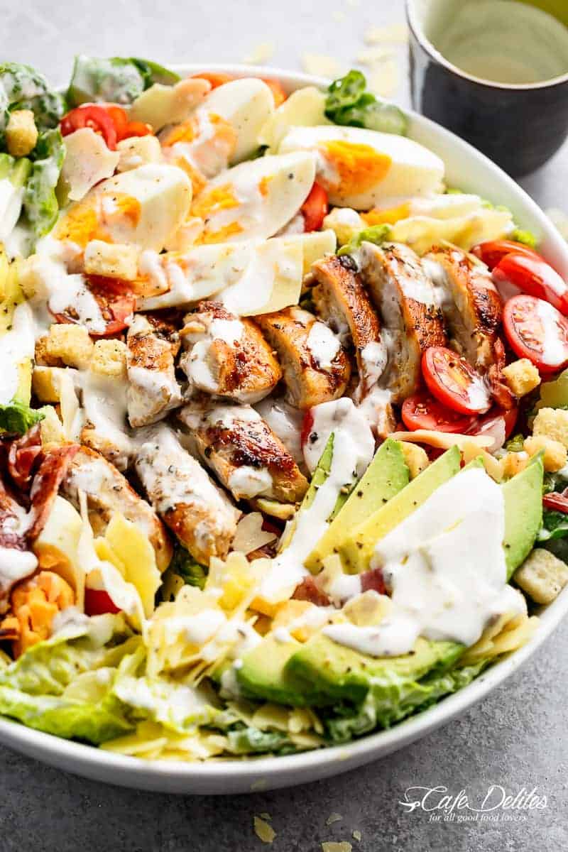 Grilled Chicken Cobb Caesar Salad is a meal in a salad Grilled Chicken Cobb Caesar Salad