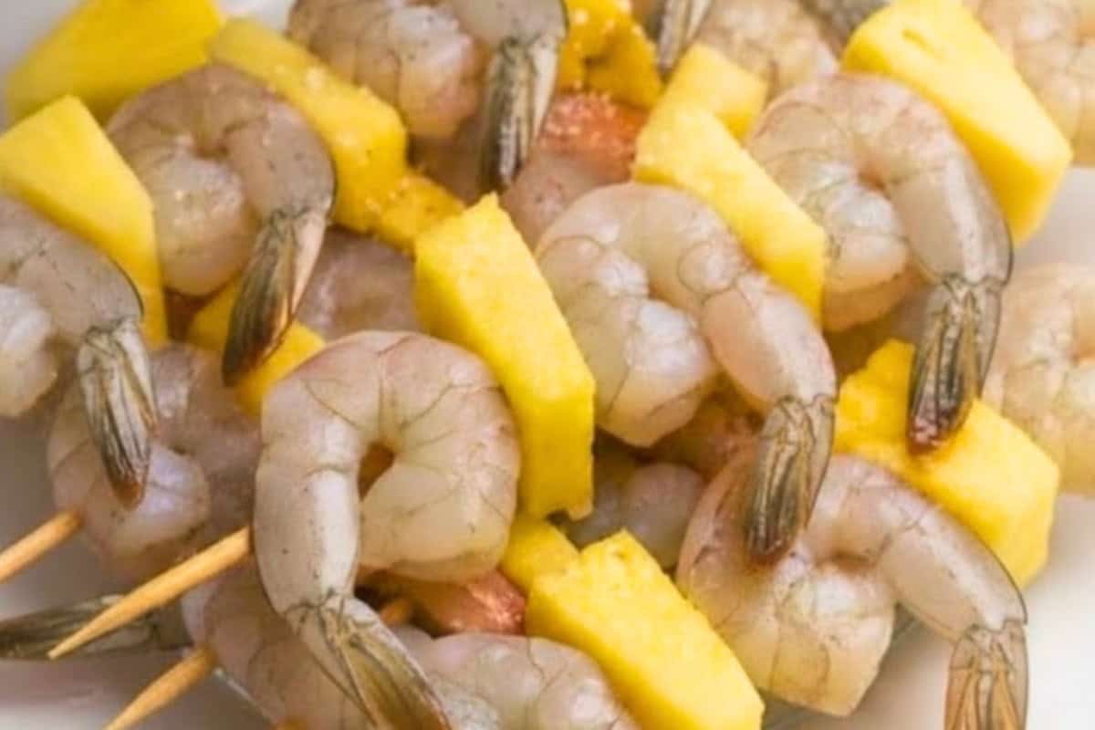 Once soaked, alternate shrimp and pineapple pieces on each skewer