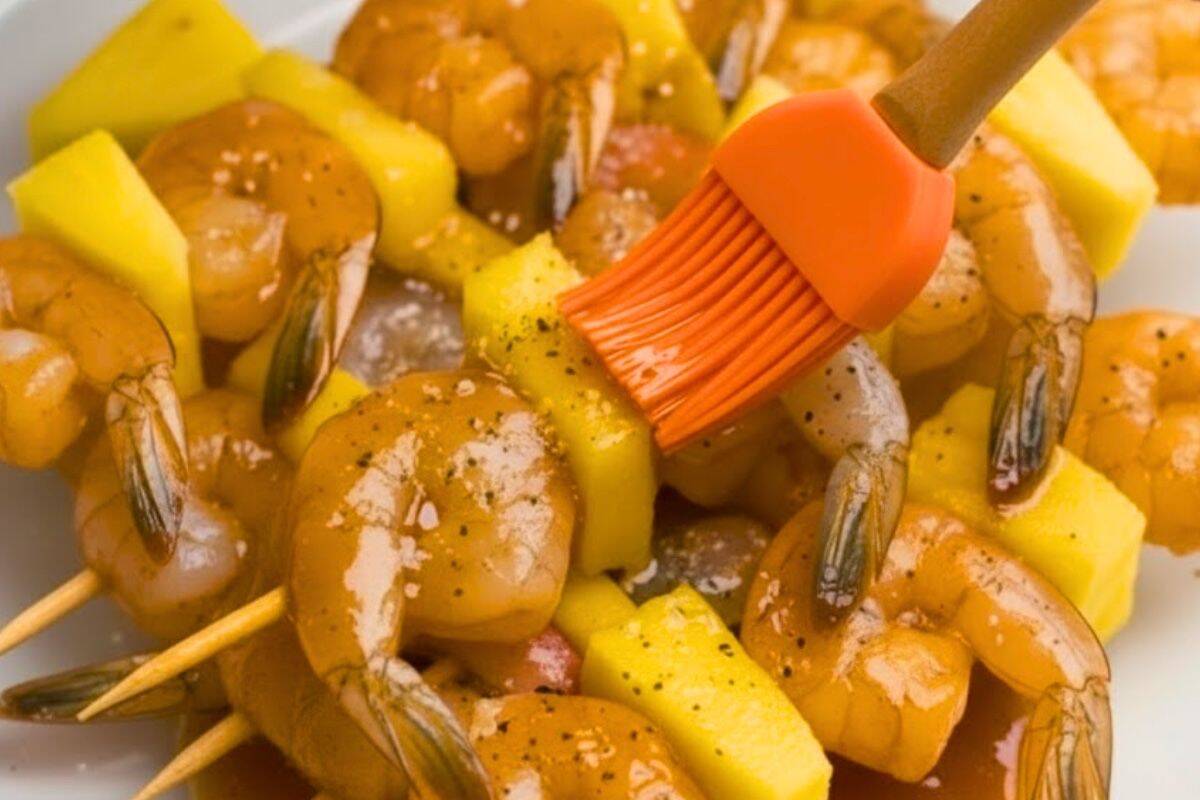 Brush both sides of each skewer with the honey garlic butter sauce until evenly coated and glossy.