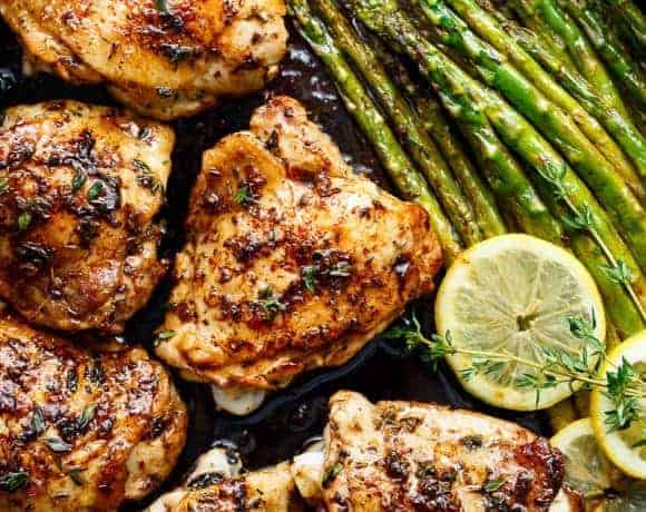 Top view of Lemon Garlic Butter Chicken Thighs with Asparagus