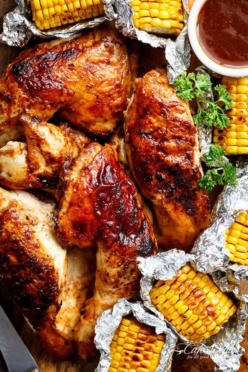 Bring your favourite Nando's chicken to the table with this Portuguese BBQ Peri Peri Chicken Recipe! PLUS the addition of juicy corn cobs in foil packets are charred for added flavour. | https://cafedelites.com