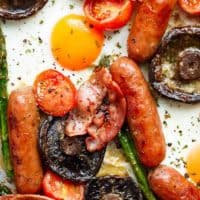 Sheet Pan Full Breakfast complete with eggs, bacon, sausages, tomatoes, asparagus, and GARLIC BUTTER MUSHROOMS! And only one pan to wash up! | https://cafedelites.com