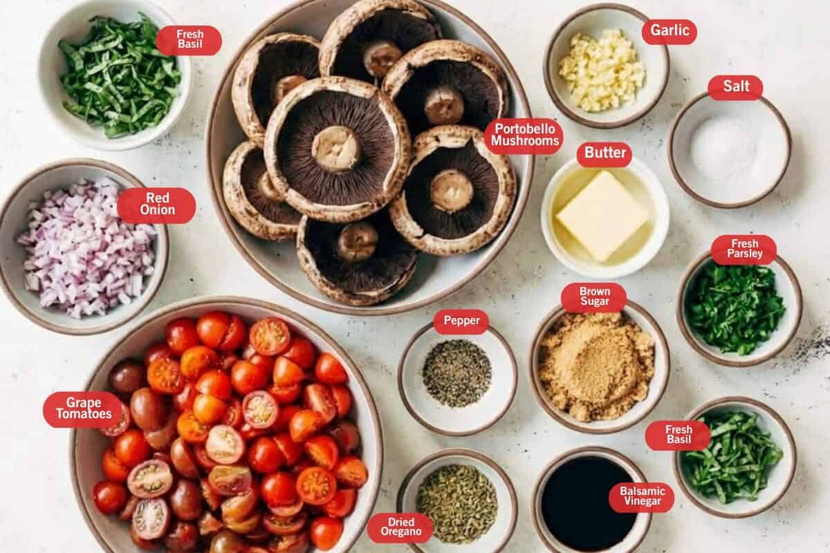 Flat lay photo of ingredient shot of fresh basil, portobello mushrooms, garlic, salt, butter, salt, fresh parsley, brown sugar, pepper, dried oregano, grape tomatoes, balsamic vinegar