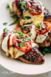 Grilled Chicken Caprese, with soft, creamy Buffalo Mozzarella slices will become a family favourite grilling recipe! A low carb lunch or dinner! | https://cafedelites.com