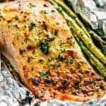 Lemon Parmesan Salmon & Asparagus Foil Packs are so easy to make, and are packed with flavour! Baked OR grilled right on your barbecue! | https://cafedelites.com