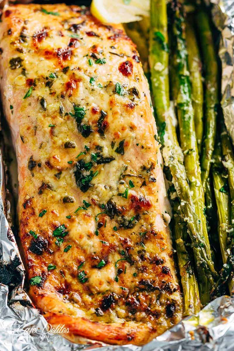 Lemon Parmesan Salmon & Asparagus Foil Packs are so easy to make, and are packed with flavour! Baked OR grilled right on your barbecue! | https://cafedelites.com