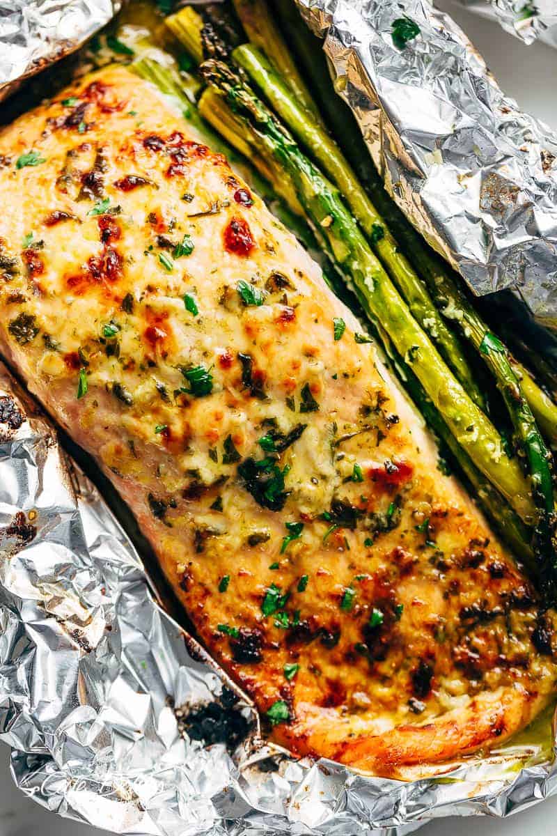Lemon Parmesan Salmon & Asparagus Foil Packs are so easy to make, and are packed with flavour! Baked OR grilled right on your barbecue! | https://cafedelites.com