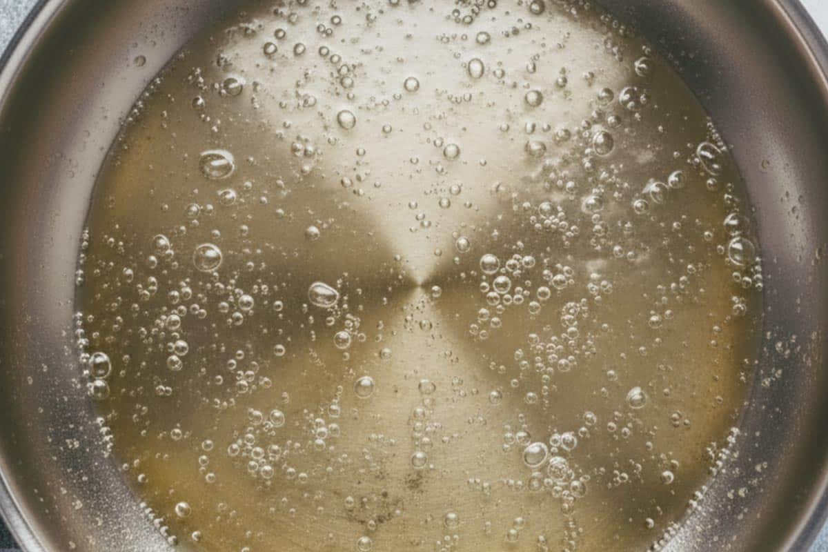 Heating the oil in the pan.