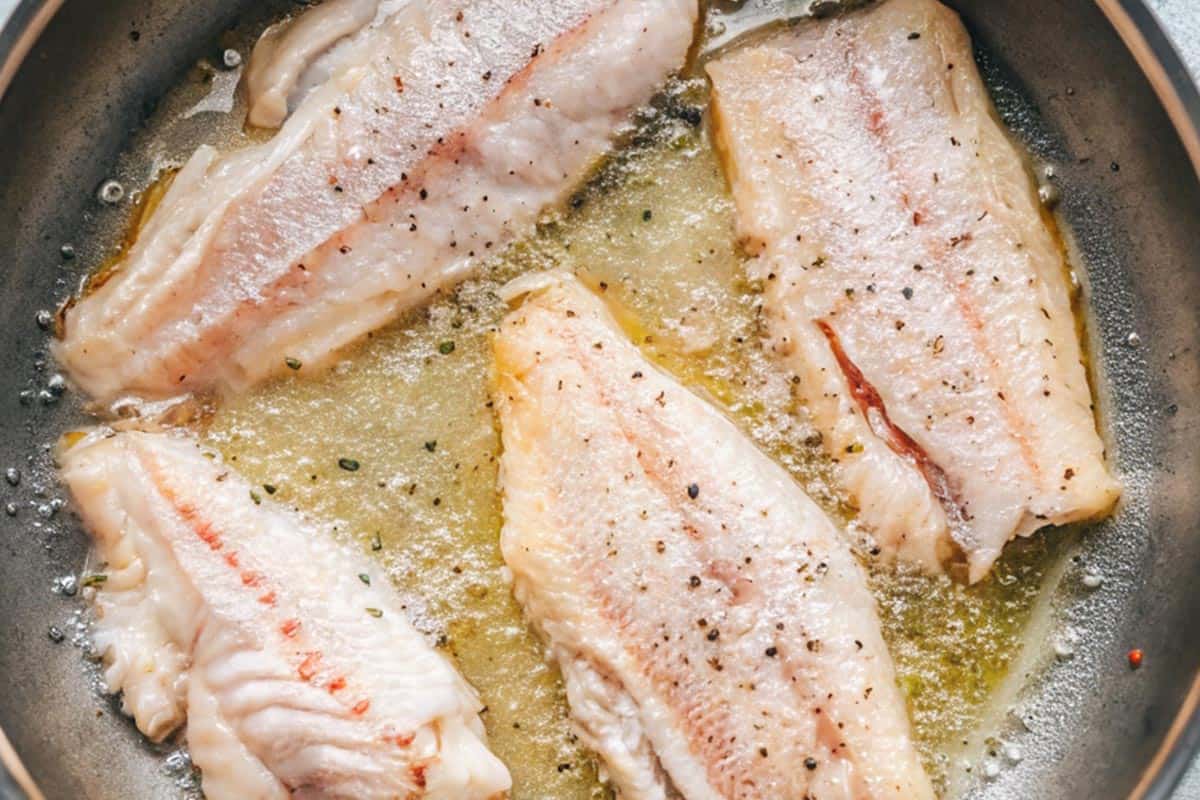 Frying the fish fillets.