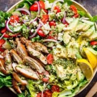 Move over boring salads...this Pesto Grilled Chicken Avocado Salad will become your new favourite salad, using a pesto dressing to double as a marinade! | https://cafedelites.com
