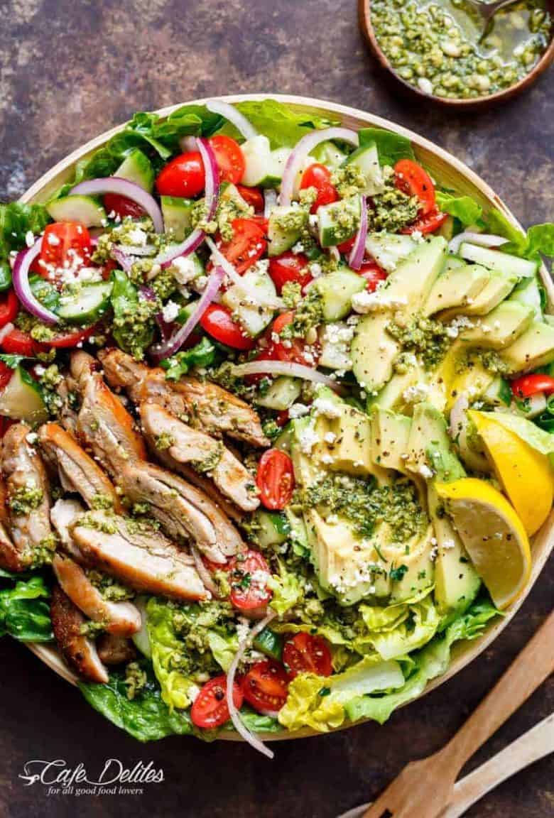 Move over boring salads...this Pesto Grilled Chicken Avocado Salad will become your new favourite salad, using a pesto dressing to double as a marinade! | https://cafedelites.com