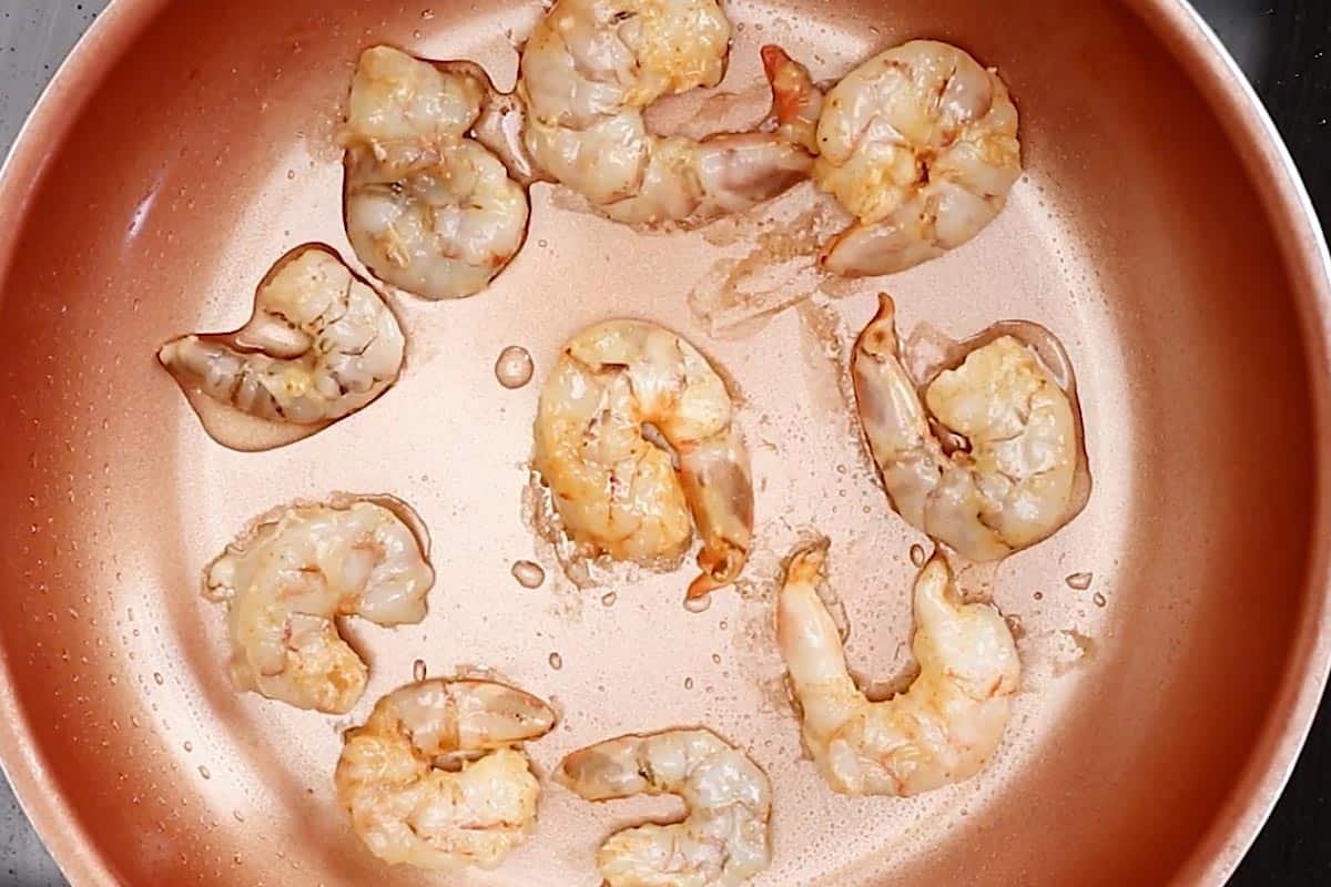 Cooking the shrimp in the pan.
