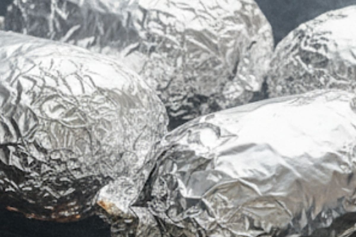 Place the sealed packets onto the hot grill and cook.