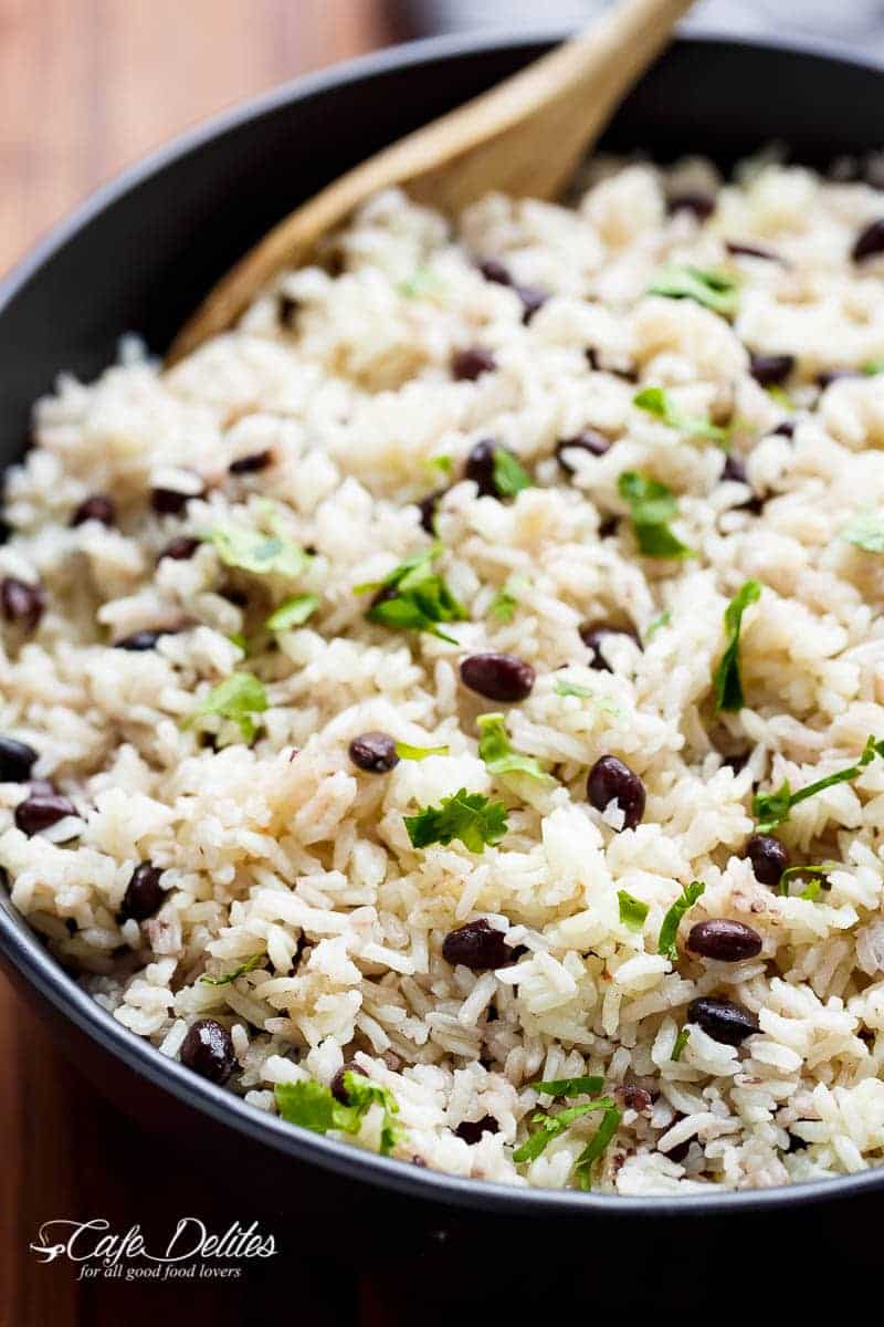 Black Beans & Rice is one of the best side recipes out there! Flavoured with a squeeze of lime juice, garlic and spices, this rice recipe is a winner! | https://cafedelites.com