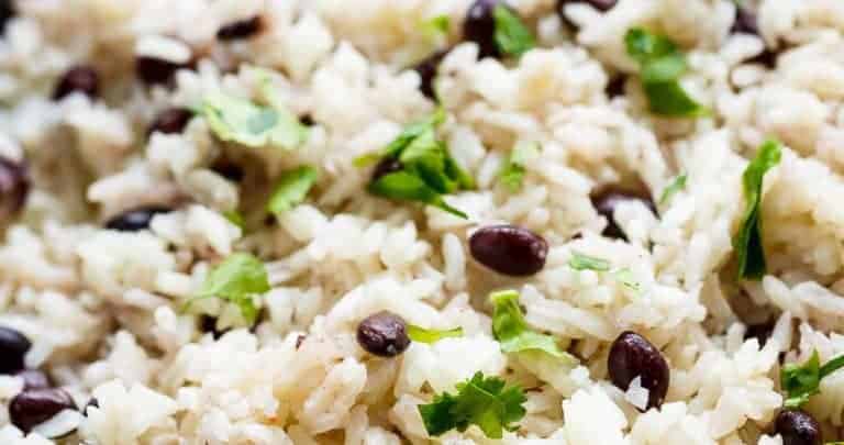 Black Beans & Rice is one of the best side recipes out there! Flavoured with a squeeze of lime juice, garlic and spices, this rice recipe is a winner! | https://cafedelites.com
