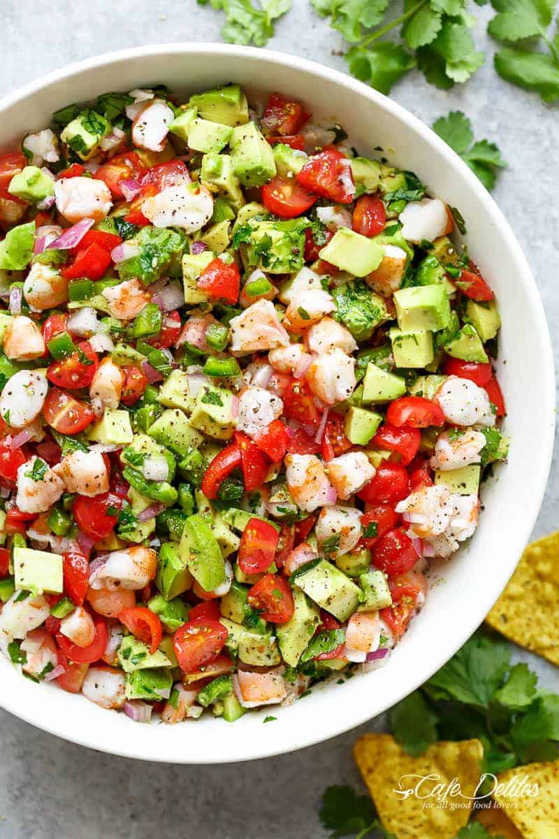 Chunky Shrimp Guacamole is easy to make, ready in minutes and always a hit with all of your guests! Serve as an appetiser, or as a salad! | https://cafedelites.com