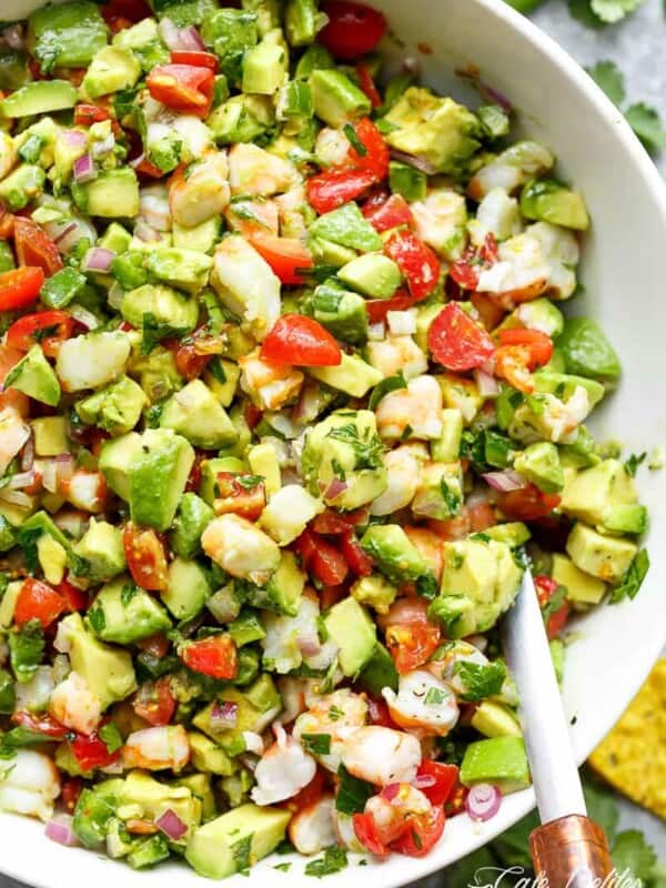 Chunky Shrimp Guacamole with spoon in a white bowl