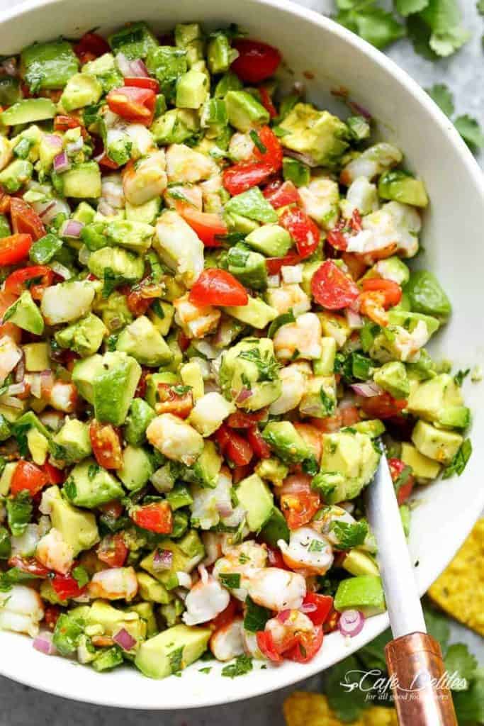 Chunky Shrimp Guacamole with spoon in a white bowl  - 1