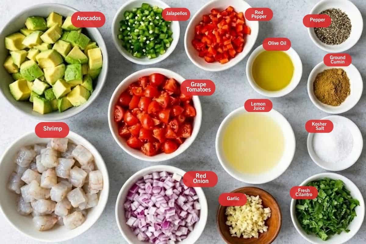Flat lay photo of ingredient shot of avocados, jalapeños, red pepper, pepper, olive oil, ground cumin, olive oil, kosher salt, fresh cilantro, garlic, red onion, grape tomatoes, shrimp - 2