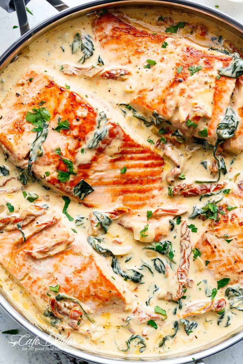 Creamy Garlic Butter Tuscan Salmon (OR TROUT) is such an incredible recipe! Restaurant quality salmon in a beautiful creamy Tuscan sauce! | https://cafedelites.com
