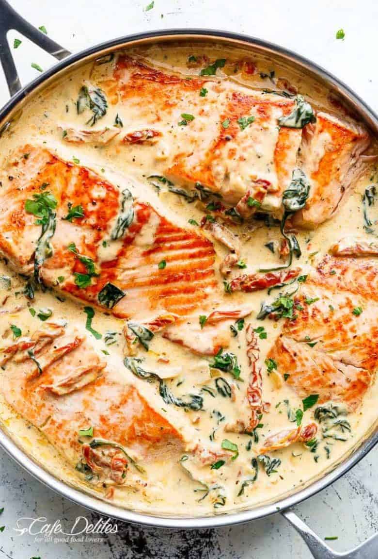 Creamy Garlic Butter Tuscan Salmon (OR TROUT) is such an incredible recipe! Restaurant quality salmon in a beautiful creamy Tuscan sauce! | https://cafedelites.com