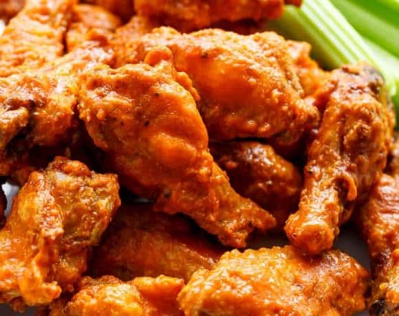 Crispy Buffalo Chicken Wings are exactly what they claim to be. CRISPY without deep frying, using one special ingredient you have in your kitchen pantry! | https://cafedelites.com