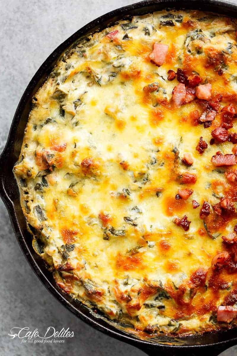 Warm Spinach Bacon Artichoke Dip is a hit around the table! Made with minimal ingredients and topped with crispy bacon, what's not to love! | https://cafedelites.com