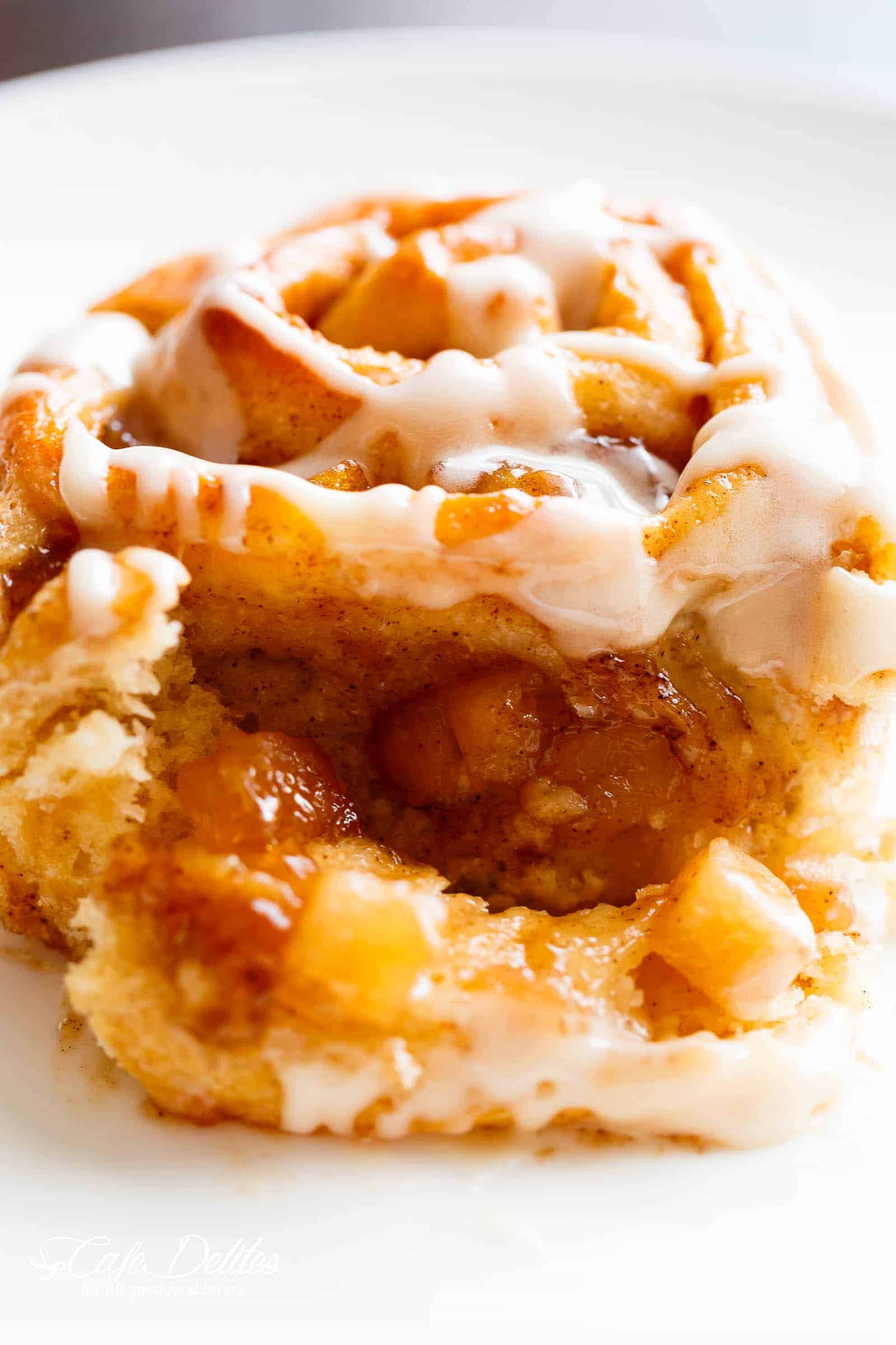 Apple Pie Cinnamon Rolls are soft and fluffy, filled with apple pie filling to make the ultimate twist for your dinner table! | cafedelites.com