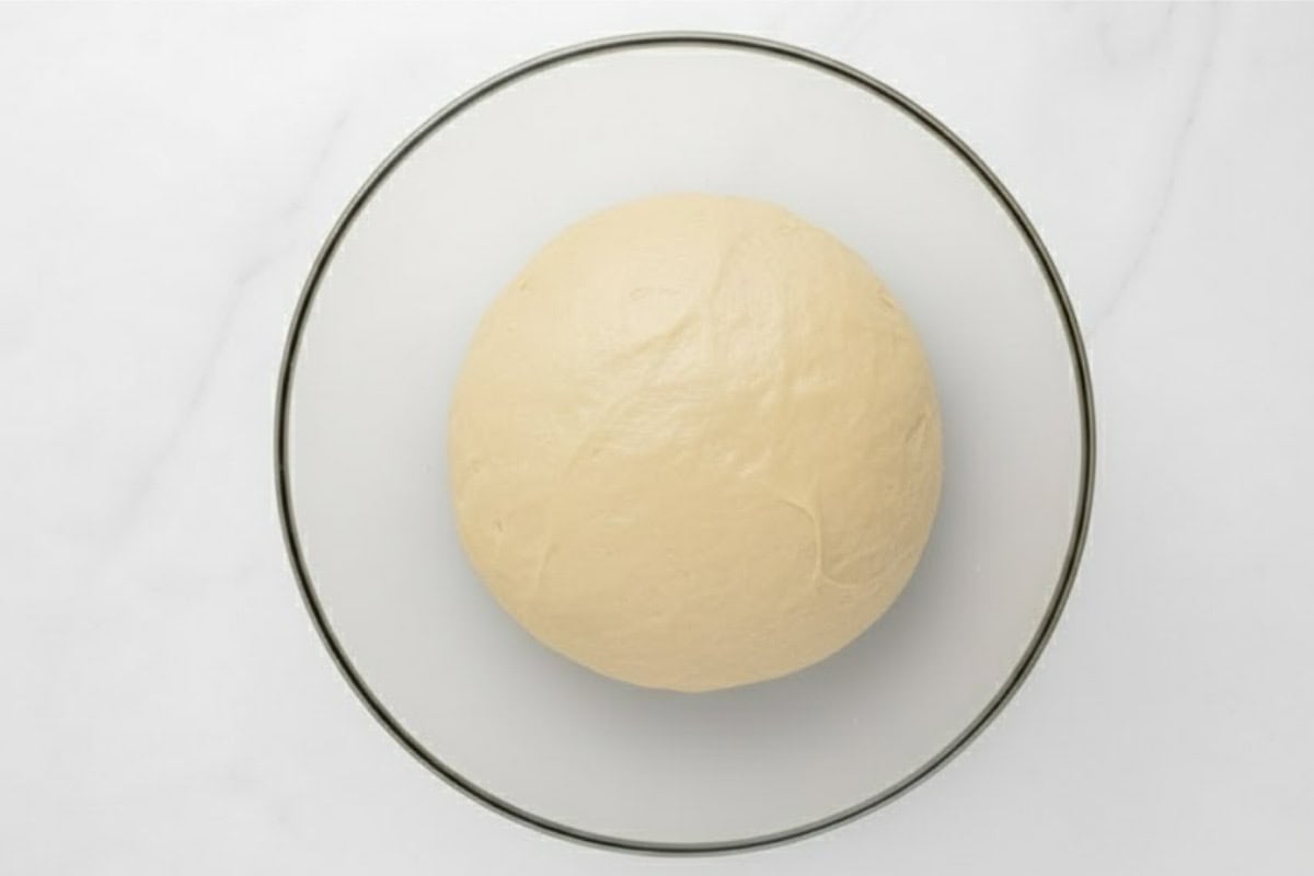  Lightly grease a bowl with cooking spray and place dough inside, turning once to coat.