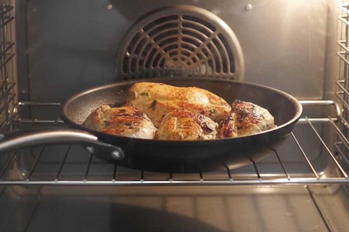 Placed the skillet with chicken in the oven. - 8
