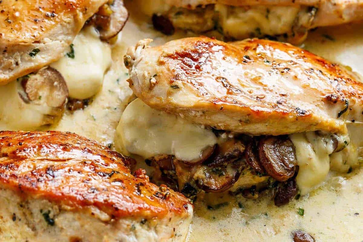 Close-up shot of Cheesy Garlic Butter Mushroom Stuffed Chicken. - 10
