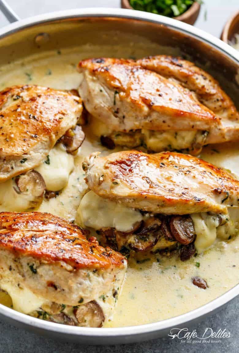 Cheesy Garlic Butter Mushroom Stuffed Chicken WITH an optional Creamy Garlic Parmesan Sauce! Garlic Mushroom lovers this is THE recipe of your dreams! | cafedelites.com