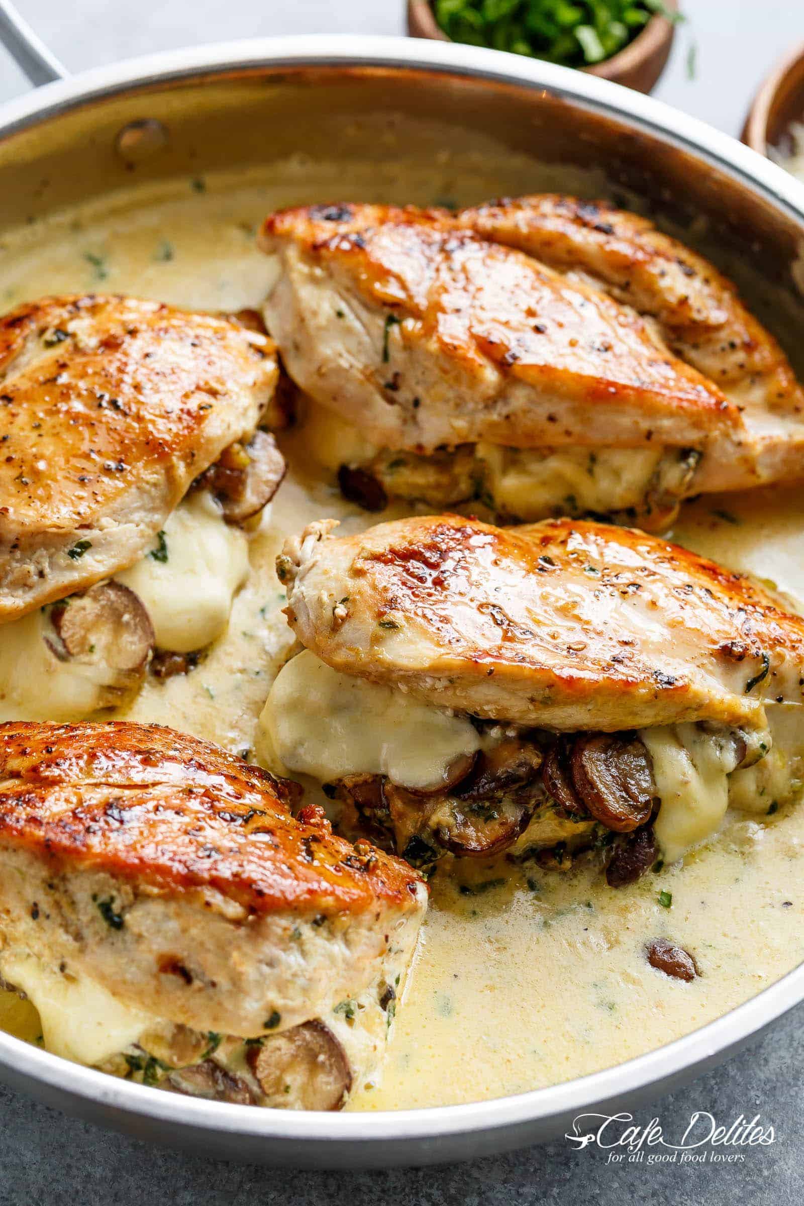 Cheesy Garlic Butter Mushroom Stuffed Chicken WITH an optional Creamy Garlic Parmesan Sauce! Garlic Mushroom lovers this is THE recipe of your dreams! | cafedelites.com