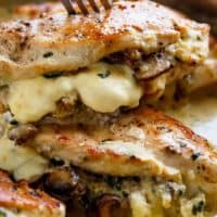 Cheesy Garlic Butter Mushroom Stuffed Chicken WITH an optional Creamy Garlic Parmesan Sauce! Garlic Mushroom lovers this is THE recipe of your dreams! | cafedelites.com