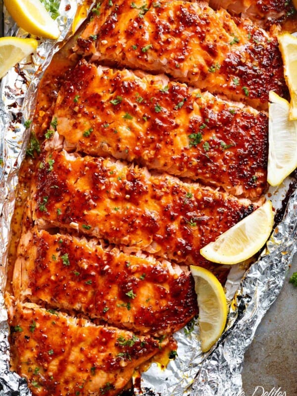 Garlic Butter Honey Mustard Salmon with some lemon wedges In Foil