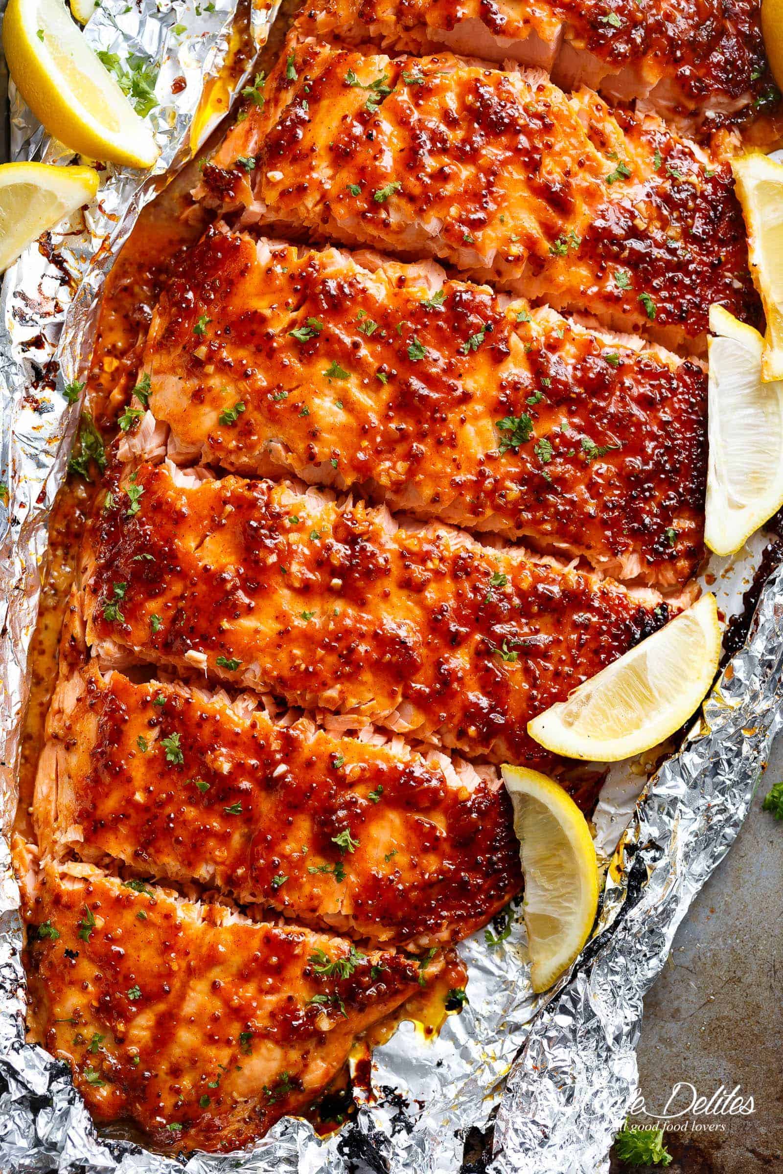 Garlic Butter Honey Mustard Salmon In Foil is a quick and easy salmon recipe, leaving you with no pans to wash and a juicy salmon for your dinner table! | cafedelites.com