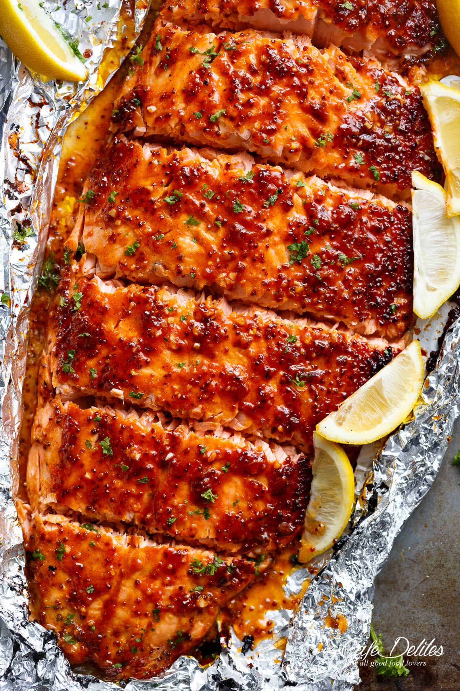 Garlic Butter Honey Mustard Salmon In Foil is a quick and easy salmon recipe, leaving you with no pans to wash and a juicy salmon for your dinner table! | cafedelites.com