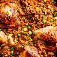 One Pan Asian Chicken and Rice equals crispy skinned chicken full of incredible Chinese-inspired flavours sits on top of a fried rice inspired skillet!