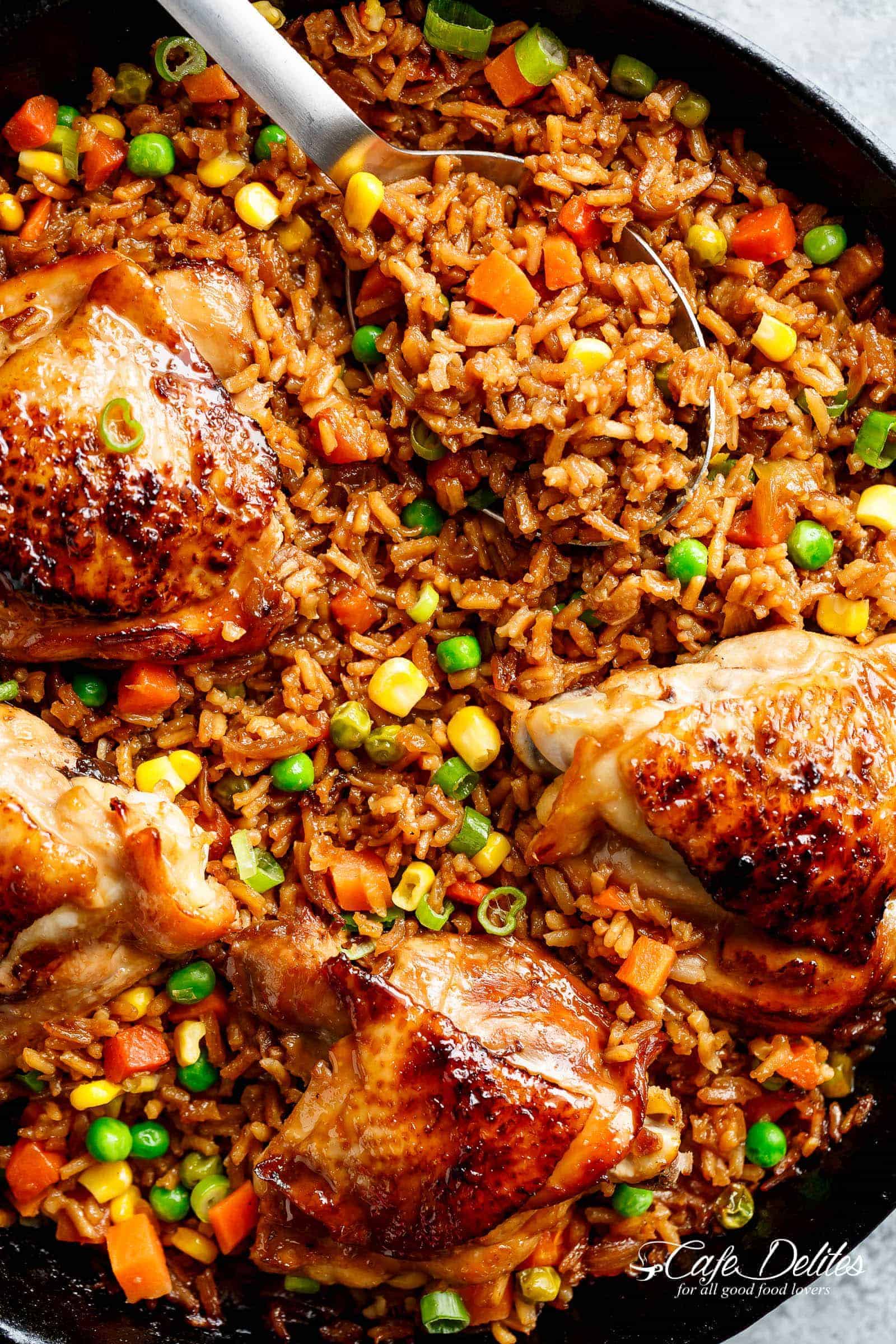 One Pan Asian Chicken and Rice equals crispy skinned chicken full of incredible Chinese-inspired flavours sits on top of a fried rice inspired skillet! | cafedelites.com