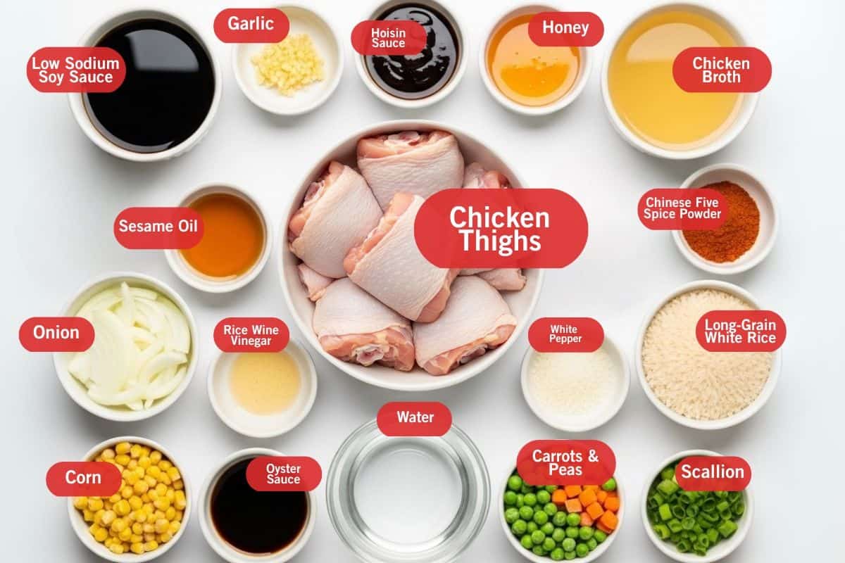 Flat lay photo of ingredient shot of low sodium soy sauce, garlic, hoisin sauce, honey, chicken broth, sesame oil, chicken thighs, Chinese five spice powder, long grain white rice, scallion, carrots and peas, water, white pepper, oyster sauce, corn, onion, sesame oil, rice wine vinegar