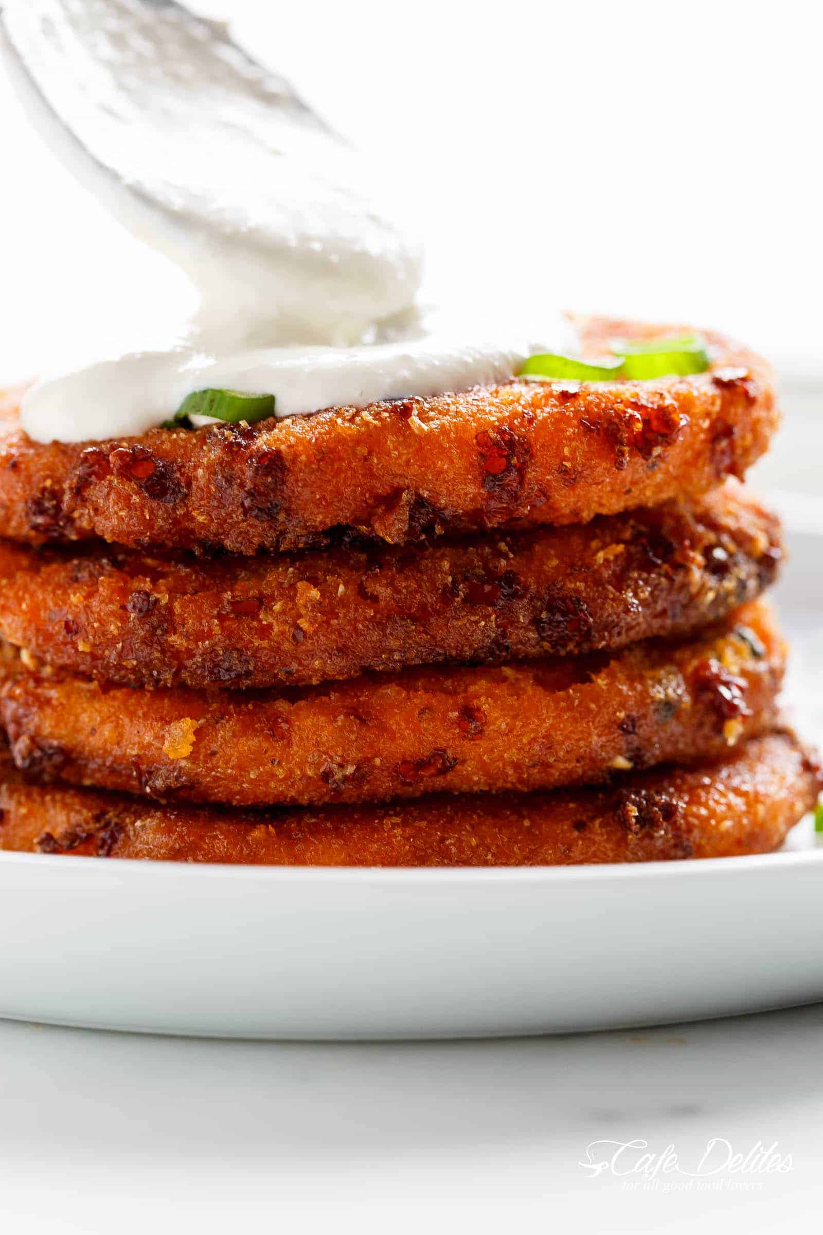 Cheesy Mashed Sweet Potato Cakes are the perfect snack! Cheesy on the inside, so crispy on the outside, and so easy to make! | https://cafedelites.com