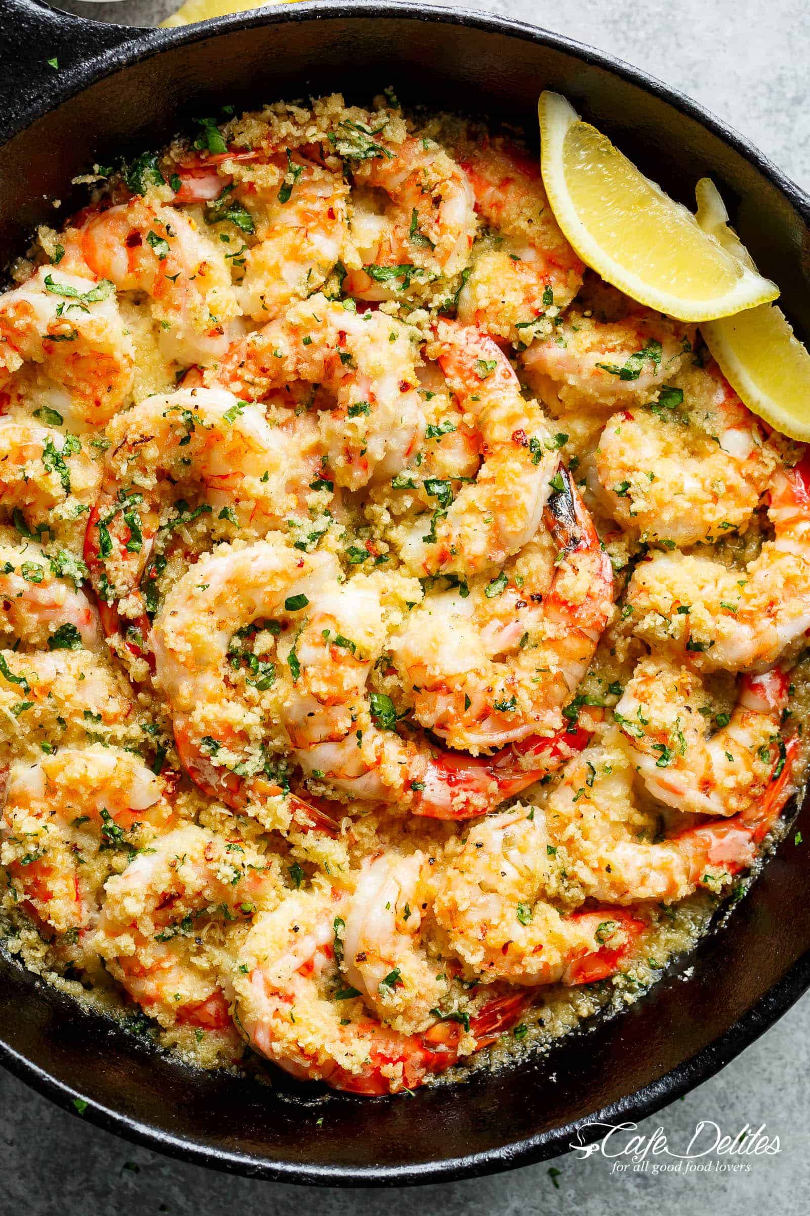 Oven baked shrimp with a hint of lemon and garlic, topped with flavourful golden and buttery, garlic parmesan breadcrumbs. This Crispy Baked Shrimp Scampi is easy to make with a fancy restaurant flair right at home, and takes only minutes to prepare! | cafedelites.com