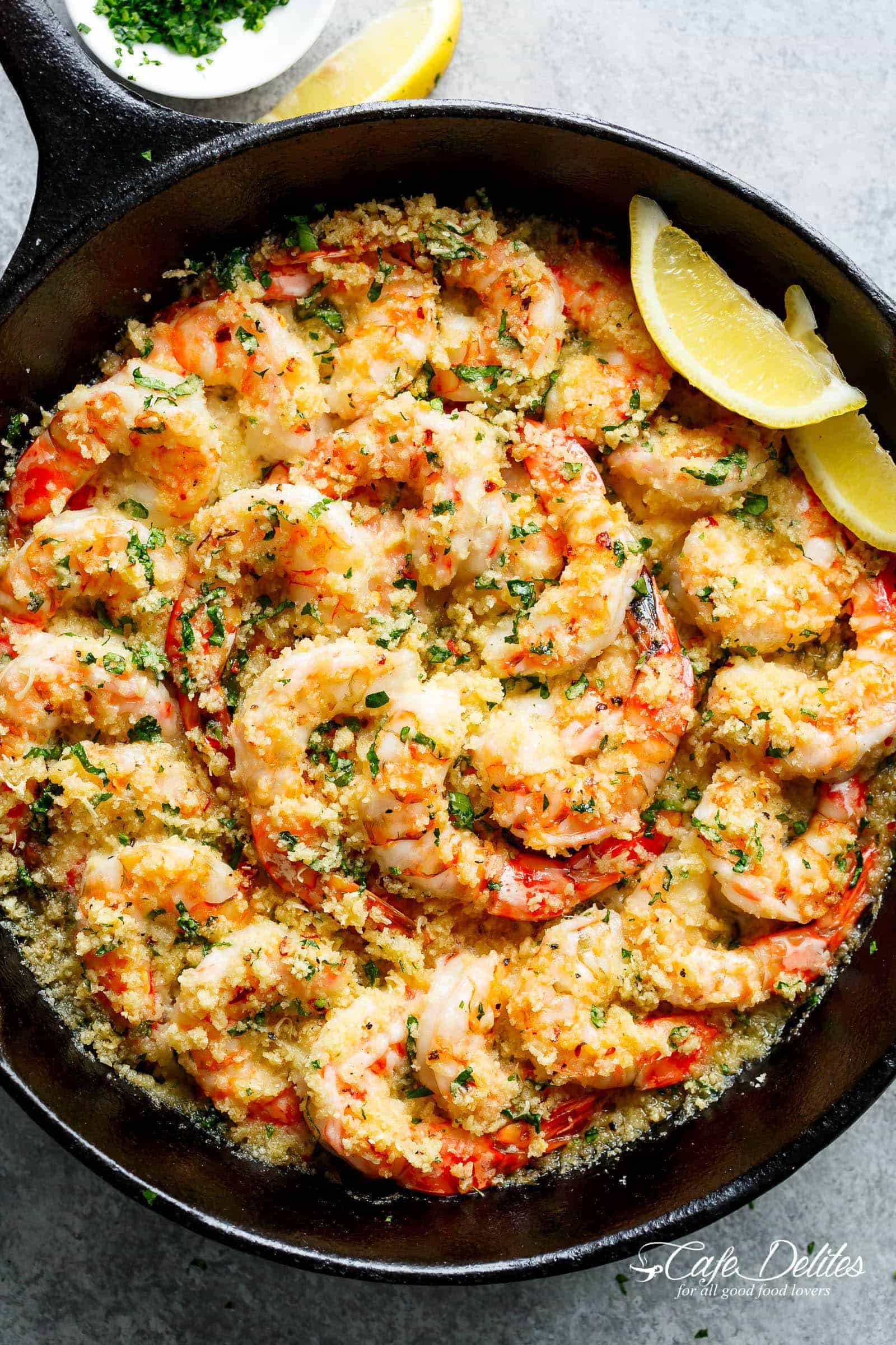 Oven baked shrimp with a hint of lemon and garlic, topped with flavourful golden and buttery, garlic parmesan breadcrumbs. This Crispy Baked Shrimp Scampi is easy to make with a fancy restaurant flair right at home, and takes only minutes to prepare! | cafedelites.com