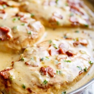 Delicious Creamy Beer Cheese Chicken With Crispy Bacon in a pan