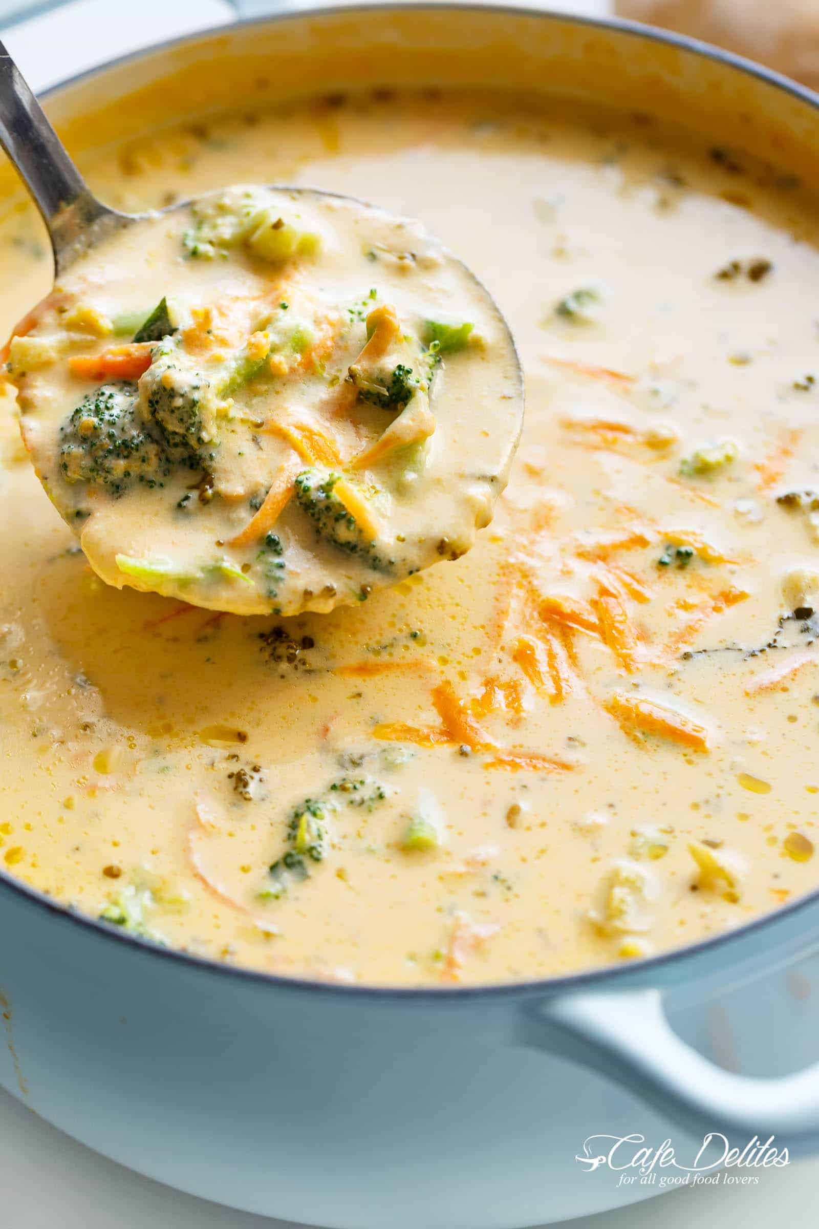 A ladle scooping Broccoli Cheese soup from a les cruset pot. 