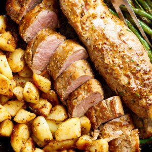 Dijon Garlic Pork Tenderloin & Veggies is a complete meal with crispy potatoes and tender green beans!